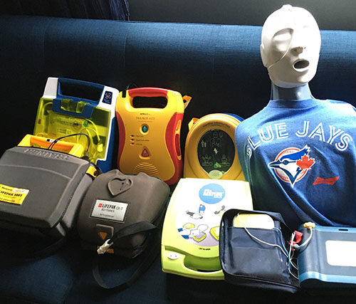 Automated external defibrillators (AEDs) on a couch with Actar